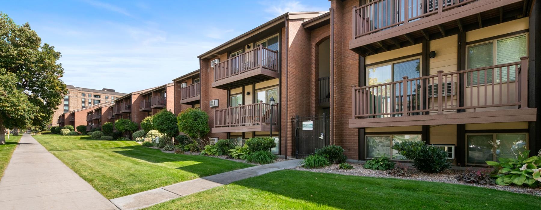 a building with a lawn and trees