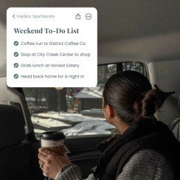 a man in a car holding a coffee