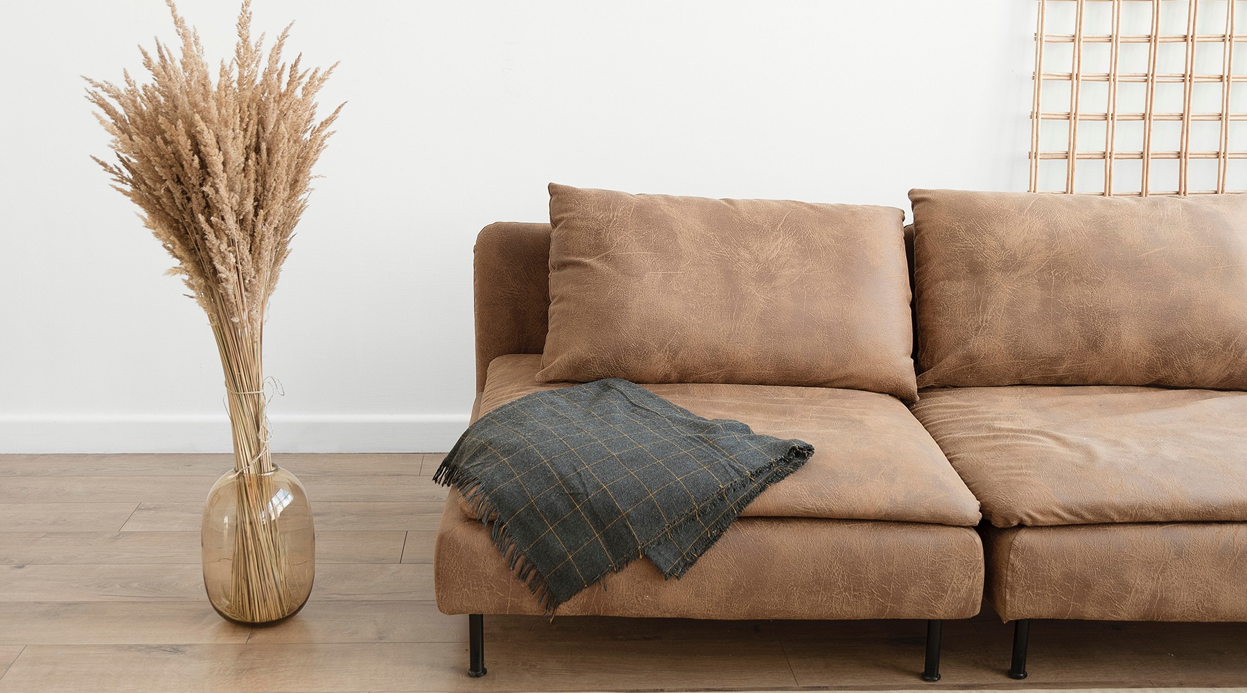 a brown couch in a bright room